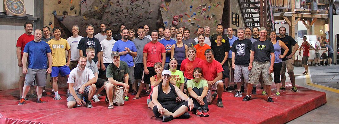 Group learning to rock climb at Petra Cliffs in Burlington Vermont